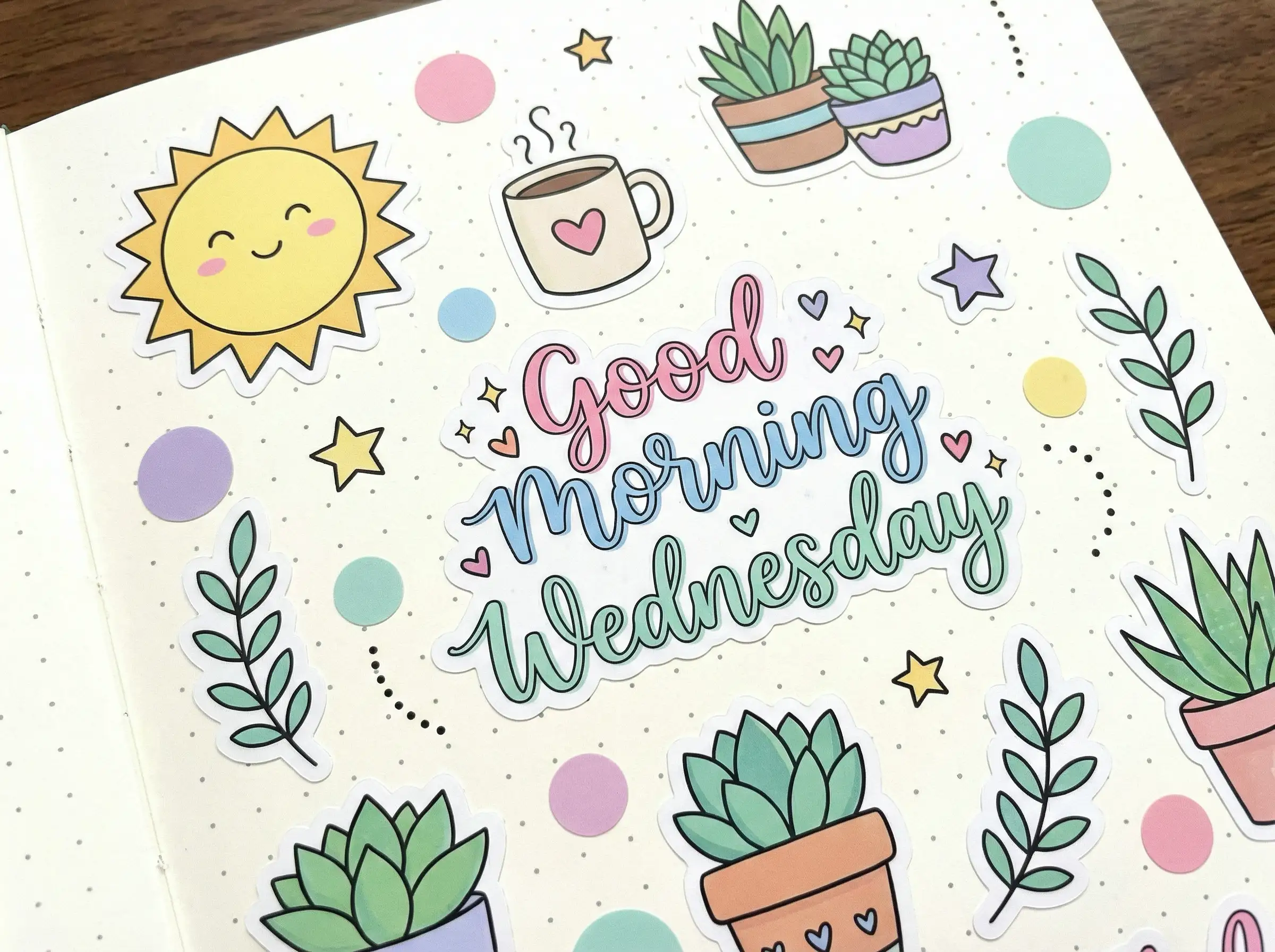 Cute bullet‑journal sticker style, pastel icons of sun, coffee, plants, round shapes, decorative doodles, cheerful “Good Morning Wednesday” text