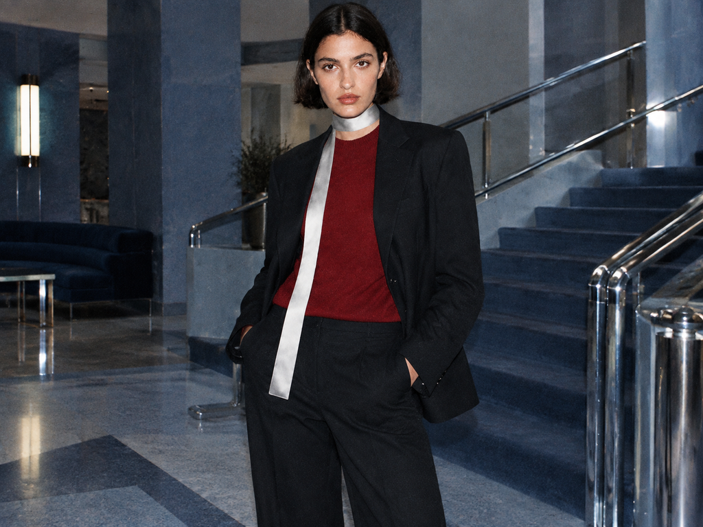 Fashion muse in a blue-gray modernist hotel